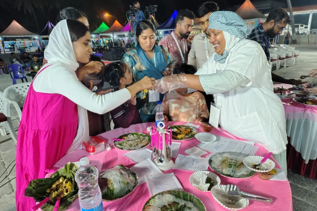 The photo shows attendees at the Matsya Mela meeting