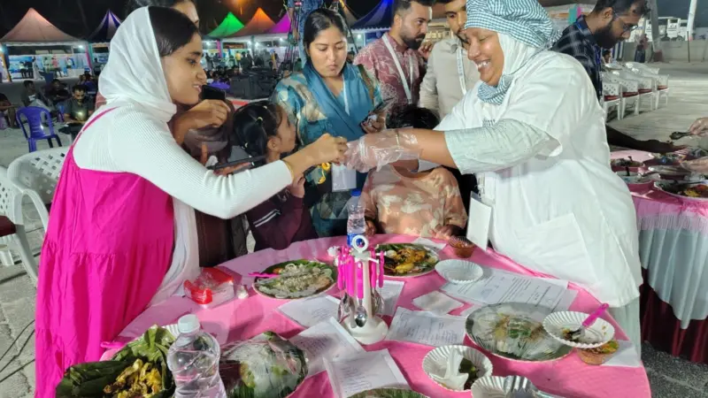 The photo shows attendees at the Matsya Mela meeting