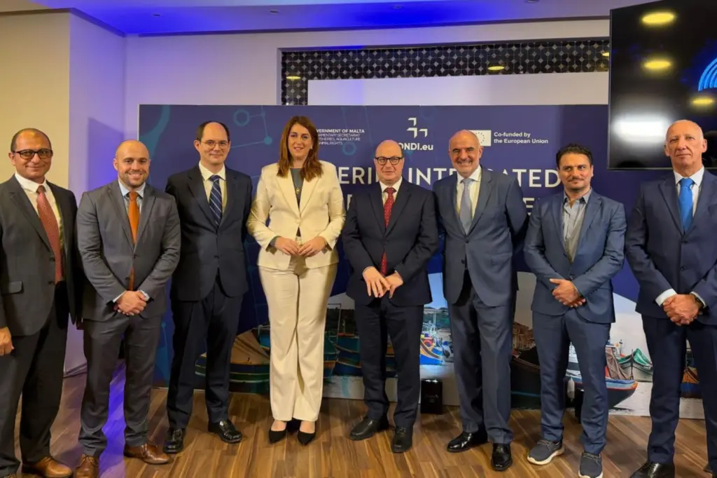 The image shows attendees at the official launch of FIIS Malta