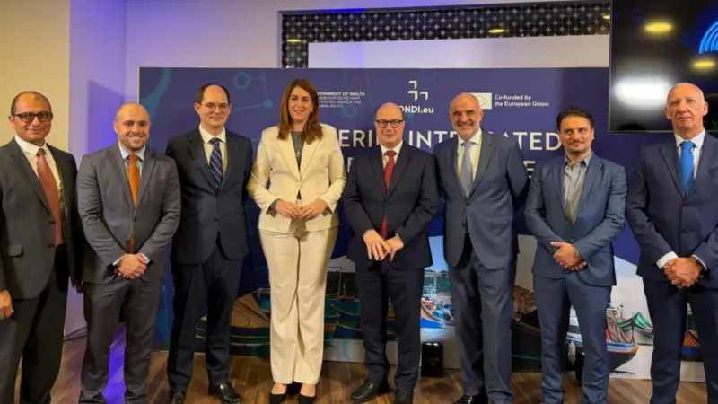 The image shows attendees at the official launch of FIIS Malta