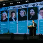 Speaker on stage at an ASC event in Vietnam